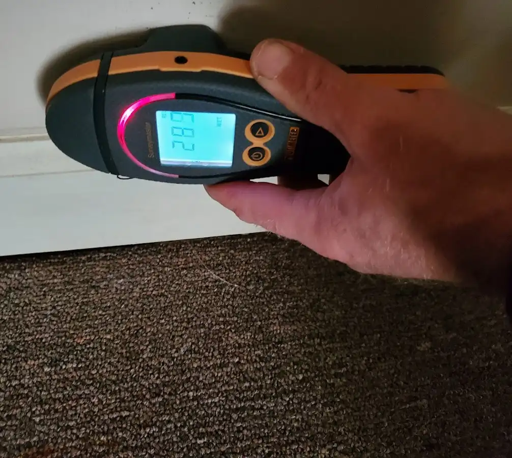 Moisture detection at baseboard during Storm Damage Restoration in Eastern Goleta Valley